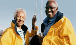 A couple enjoys time on their sailboat with peace of mind knowing their 20-Pay Whole Life Insurance will be fully paid up with no additional premium due when they retire.